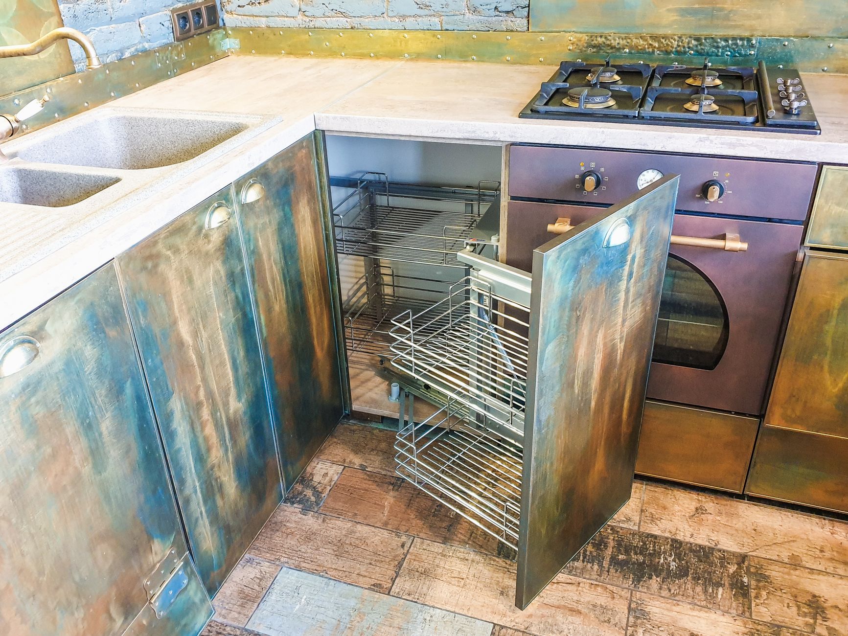 A modern kitchen featuring rustic metal cabinets and a gas stove, highlighting innovative interior design in Austin, TX